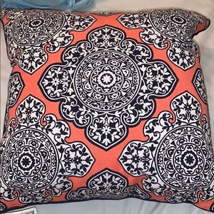 coral, navy, and white designed throw pillow